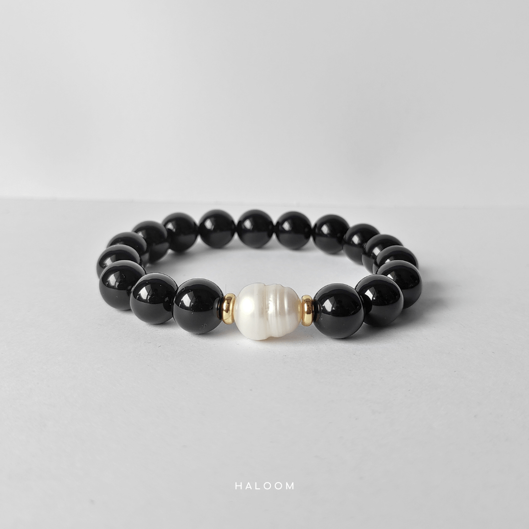 Grounded and calm black onyx with freshwater pearl