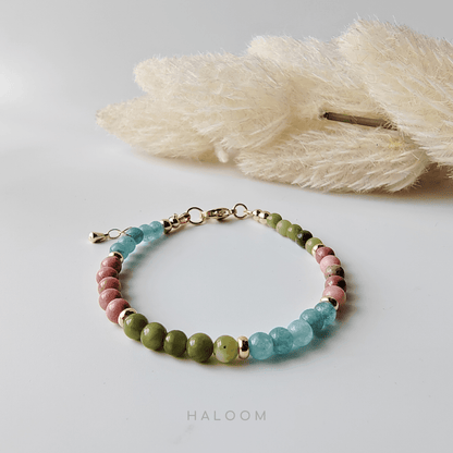 Emotional healing bracelet with jade, rhodochrosite, & aquamarine.