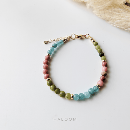 Emotional healing bracelet with jade, rhodochrosite, & aquamarine.