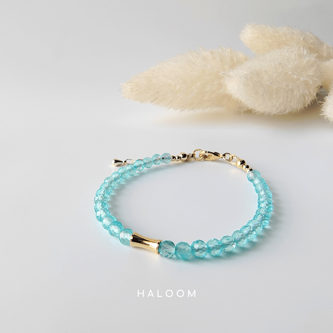 Blue topaz December birthstone bracelet with gold bar
