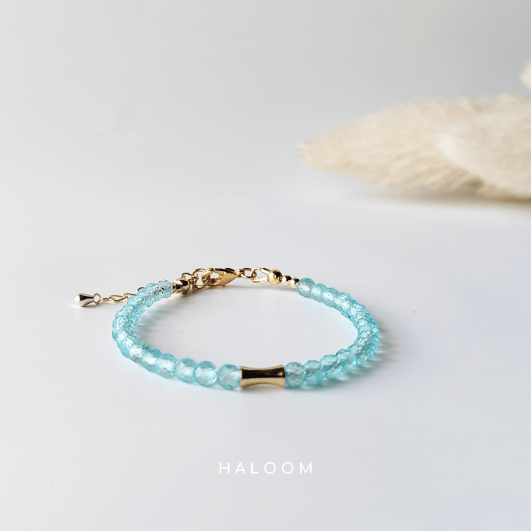 Blue topaz December birthstone bracelet with gold bar