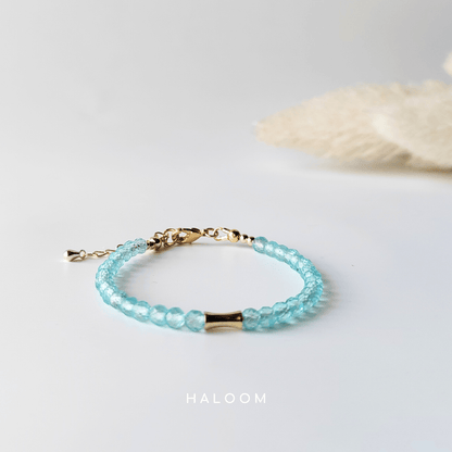 Blue topaz December birthstone bracelet with gold bar