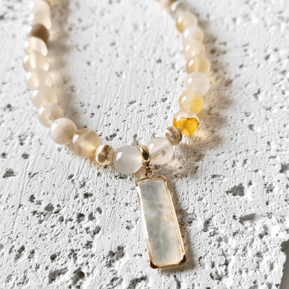 Blush & Bloom sakura agate necklace.