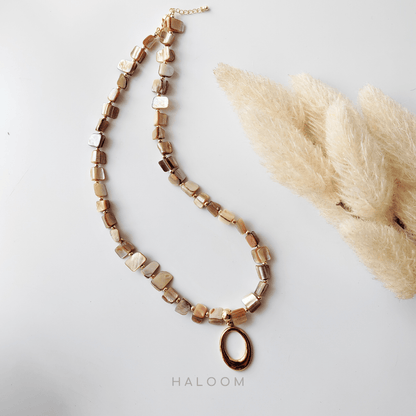 Natural shell necklace with stainless steel pendant.