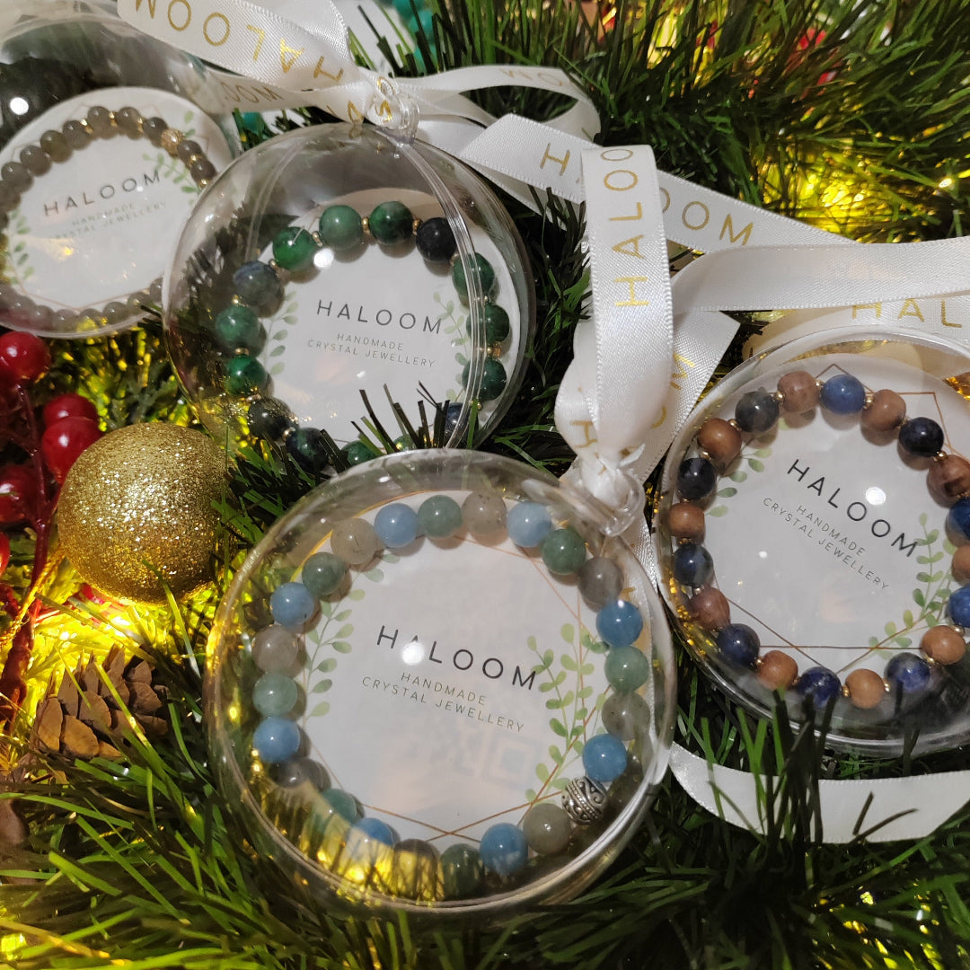 Decorative items with 'HALOOM' branding on a festive background